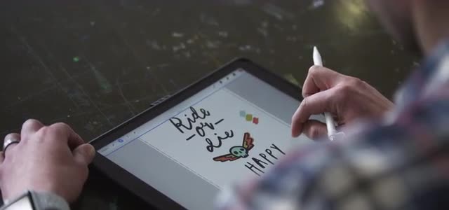 Artist sketching on her iPad at work.