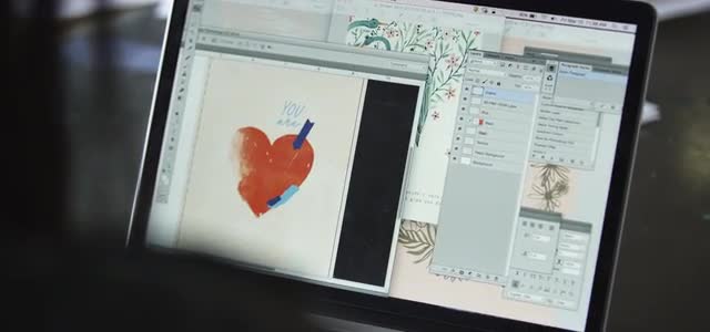 Artist making drafts digitally on her laptop