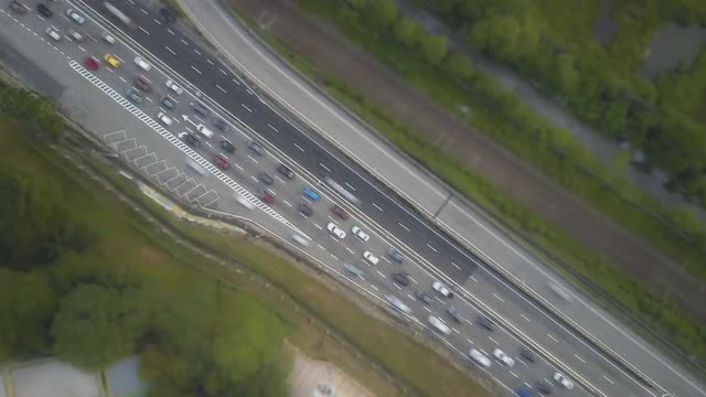 Aerial Time Lapse - Bird's Eye view of Traffic moving on a road