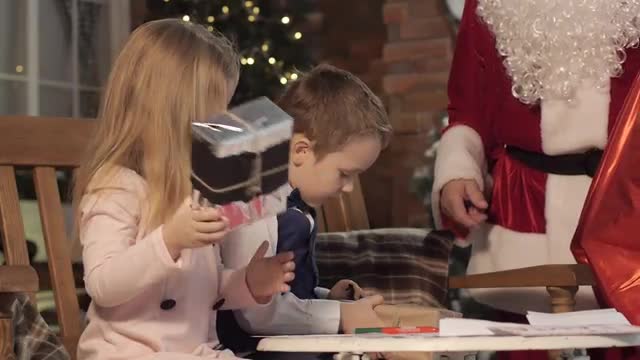 Kids Shaking Gifts Received From Santa Claus Animator Entertains Kids in Kindergarten or at Home Chr