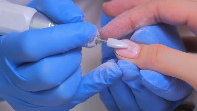 6 shots. Nail master remove nail polish in beauty saloon with special electric machine