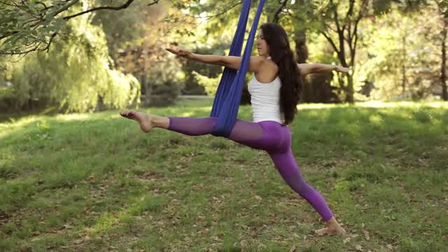 Practice of anti gravity fly yoga with hammock