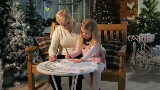 Childhood Memories Grandma and Little Girl Drawing Together at Home New Year Celebration Lights Are 
