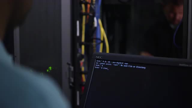 Two men working on network server