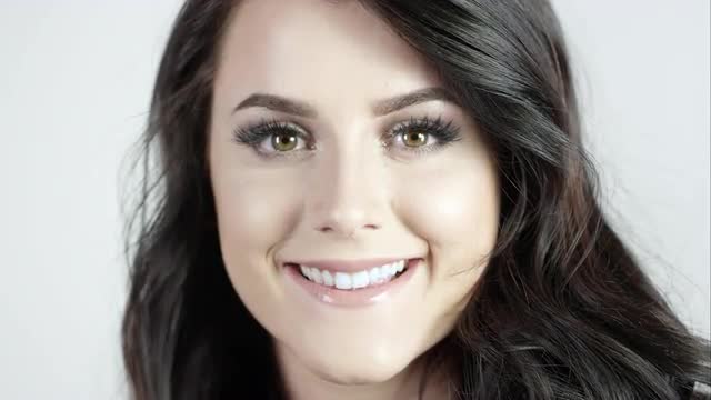 View of attractive young woman smiling