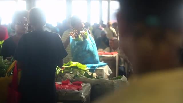 Bustling market activity in a developing country, rack focus