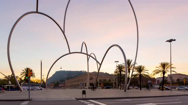 barcelona sunset port vell traffic circle metal sculpture 4k time lapse spain