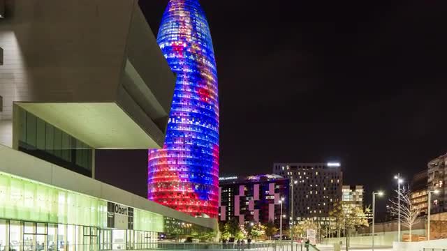 night light museum of design torre agbar view 4k time lapse spain barcelona