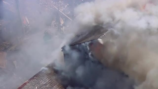 MS POV AERIAL ZO Firefighter extinguishing fire / United States