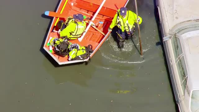 MS POV AERIAL TS ZI ZO Rescue workers patrolling on rescue boats in flooded area / United States