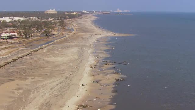 WS POV AERIAL Beaches filled with debris due to natural disaster / United States