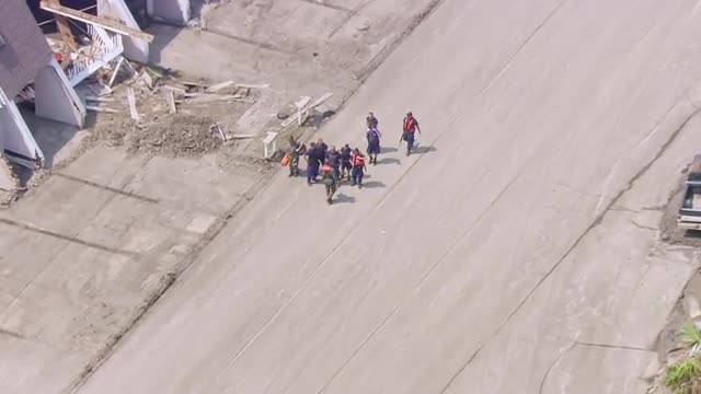 MS POV AERIAL ZI ZO View of rescue workers planning out rescue operations / United States