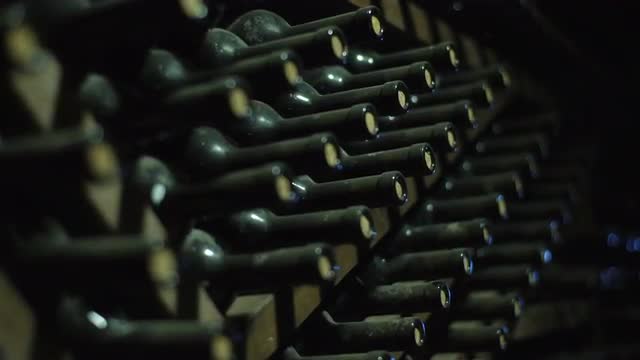 Stacked Up Wine Bottles In The Cellar