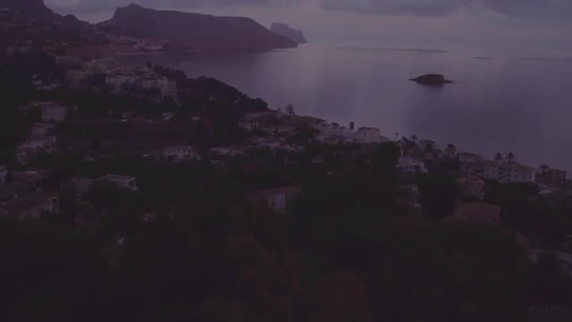 Aerial tilting up towards the coast of Calpe