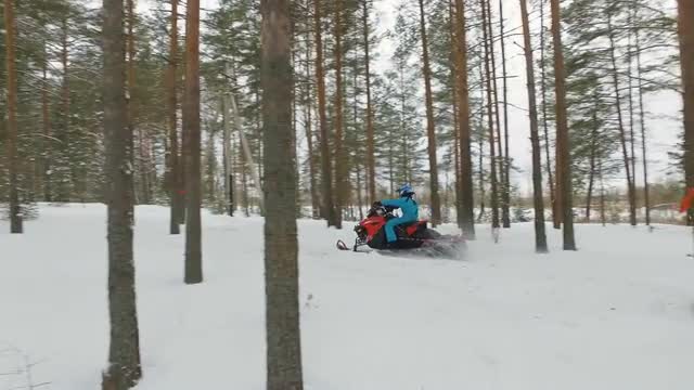 Racing on a snowmobile.