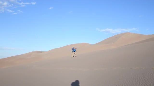 Mother Hiking With Child Carrier in Great Sand Dunes National Park