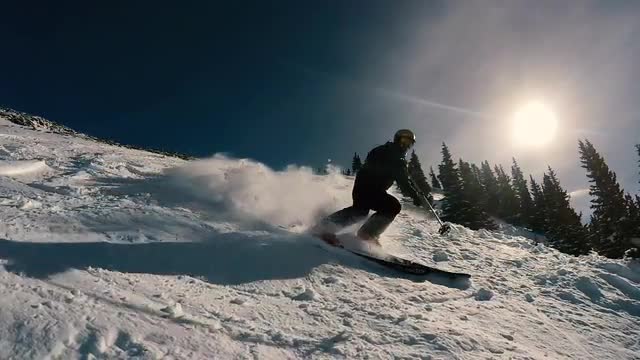 Skiing Spraying the Camera with Snow in Slow Motion