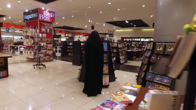 Muslim in Black in the Bookstore.