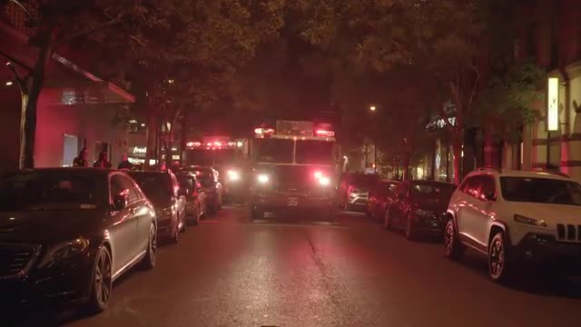 fire trucks emergency scene in the city at night