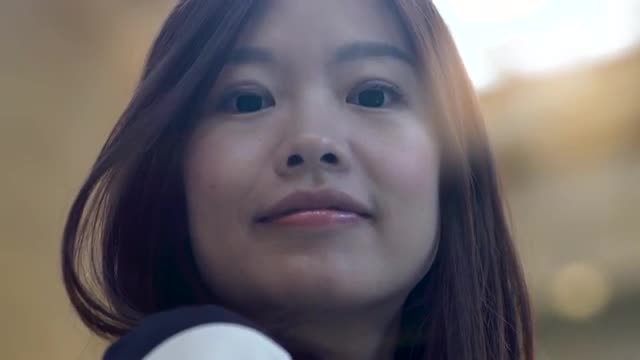 lifestyle portrait of young cute asian women looking at camera. city people view