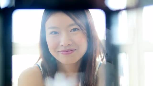lifestyle portrait of young cute asian women looking at camera. city people view