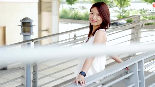 lifestyle portrait of young cute asian women looking at camera. city people view