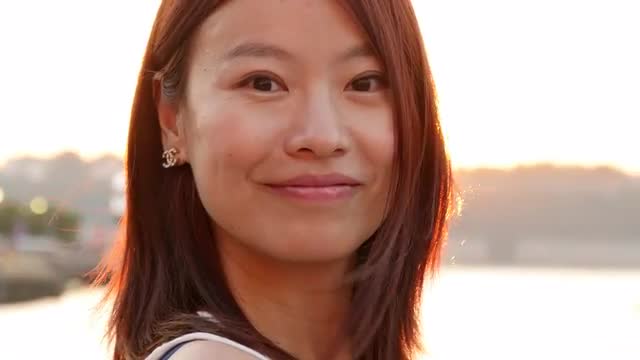 lifestyle portrait of young cute asian women looking at camera. city people view