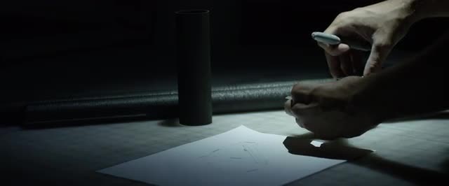 Static Medium Close Up Shot of man measuring carbon fiber tubes