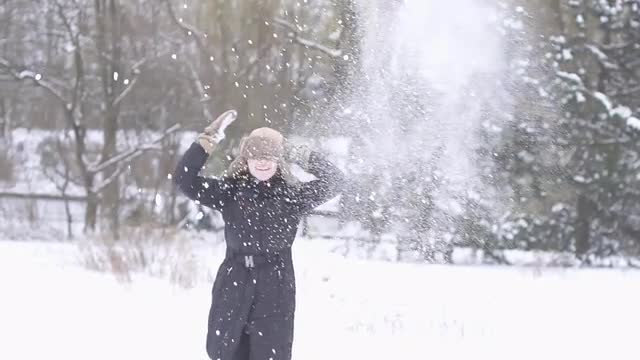 young women playing in snow winter time slow motion
