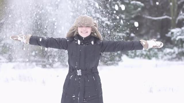 women playing with snow slow motion