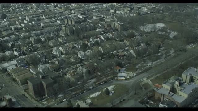 AERIAL WIDE APPROACH TILTED DOWNWARD view of a suburban town