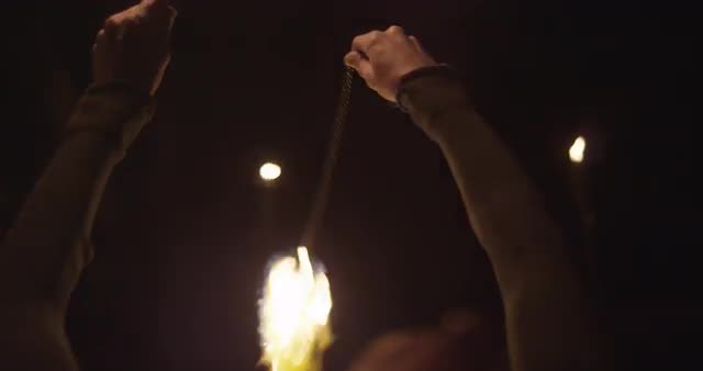 POV of Hands Twirling Fire
