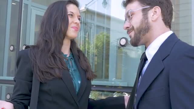 A business team celebrate with a high five and congratulate each other