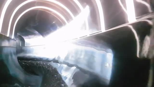 POV of a man riding water slide tube in water park