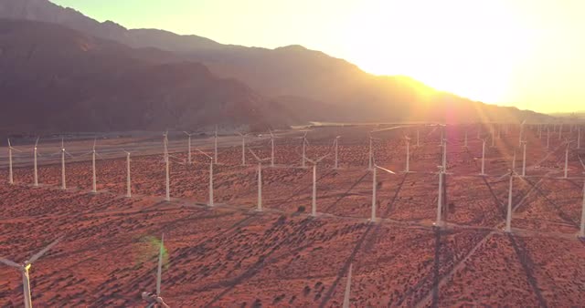 Aerial View Windmill Turbines Producing Clean Sustainable Energy At Sunset   