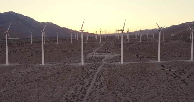 Aerial View Windmill Turbines Producing Clean Sustainable Energy At Sunset 