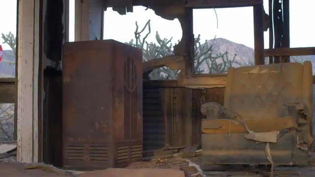 Old abandoned house with sun light on antique radio and dilapidated chair