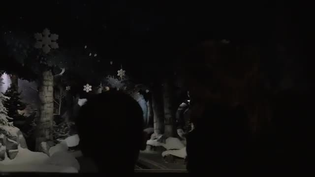 Mother and child on ride attraction in Santa Park, Rovaniemi