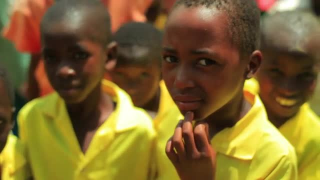 Kenyan kids smiling at the camera.