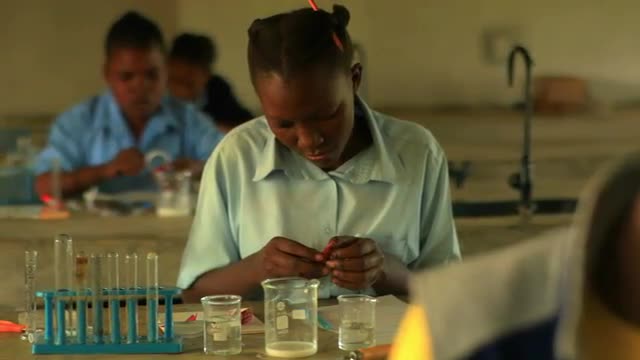 Students doing chemistry in Kenya.