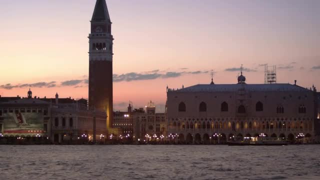 Focus racking shot of Piazza San Marco and the Doge's palace, in the evening.