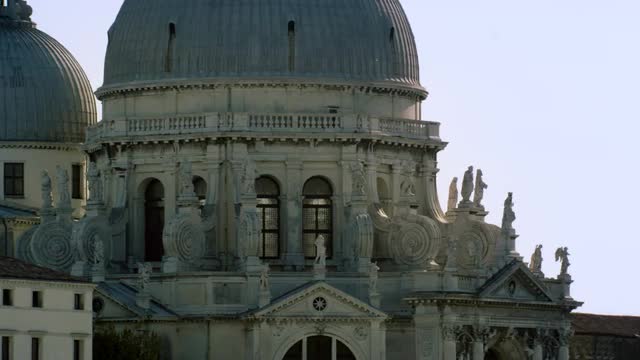 Tight static shot of the architecture of the Basilica of Santa Maria della Salute.