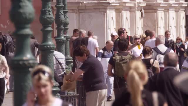 Slow motion shot of crowded walkway in front of the Traghetto Ferrovia