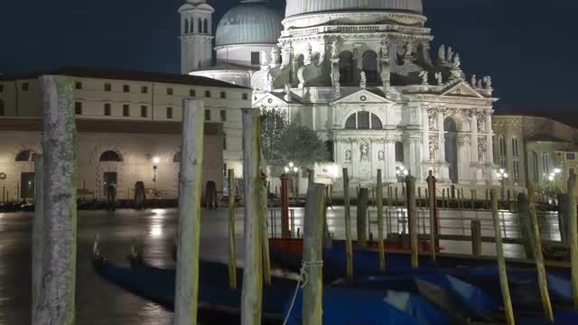Panning time-lapse of at night of Santa Maria della Salute from Saint Mark's Square.
