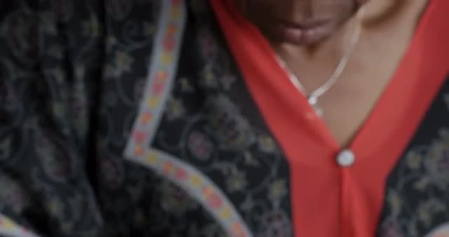 Older attractive black woman filling out a diabetes management health form