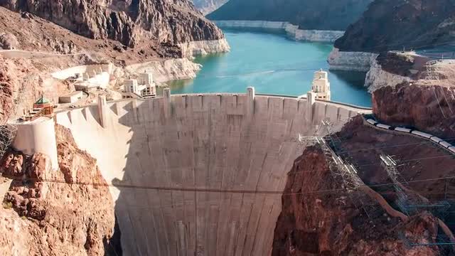 Timelapse aerial shot of the Hoover Dam in Nevada with lens flare