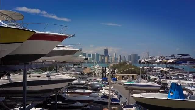 Boats Stacked and Parked in a Storage Area by the Ocean with Downtown Miami
