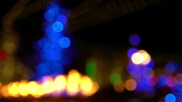 Bokeh of flame burning with Christmas lights