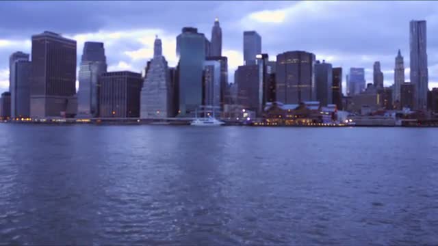 Tilting shot of hudson river and New York Cityscape.