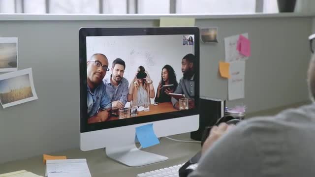 Business people video chatting about virtual reality goggles